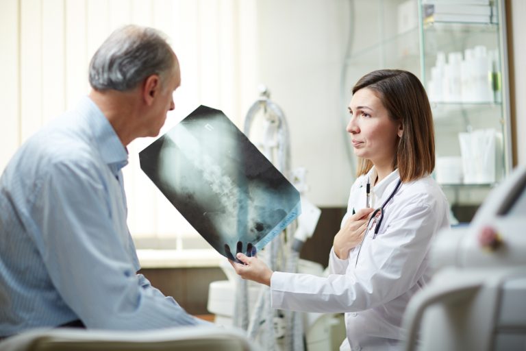Showing x-ray to patient